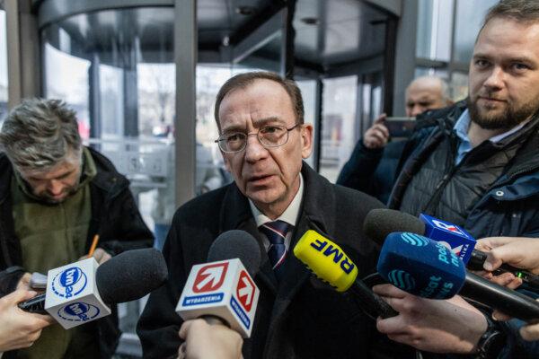 Mariusz Kaminski (C), former Polish minister of internal affairs in the PiS government and former head of the Central Anti-corruption Bureau, is seen as he enters the headquarters of Polish Public TV in Warsaw, on Dec. 20, 2023. (Wojtek Radwanski /AFP via Getty Images)