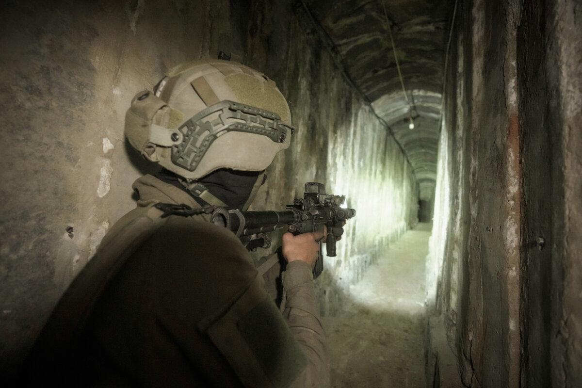 Israeli soldiers show the media a tunnel found under al-Shifa Hospital in Gaza City on Nov. 22, 2023. (Victor R. Caivano/AP Photo,, File)