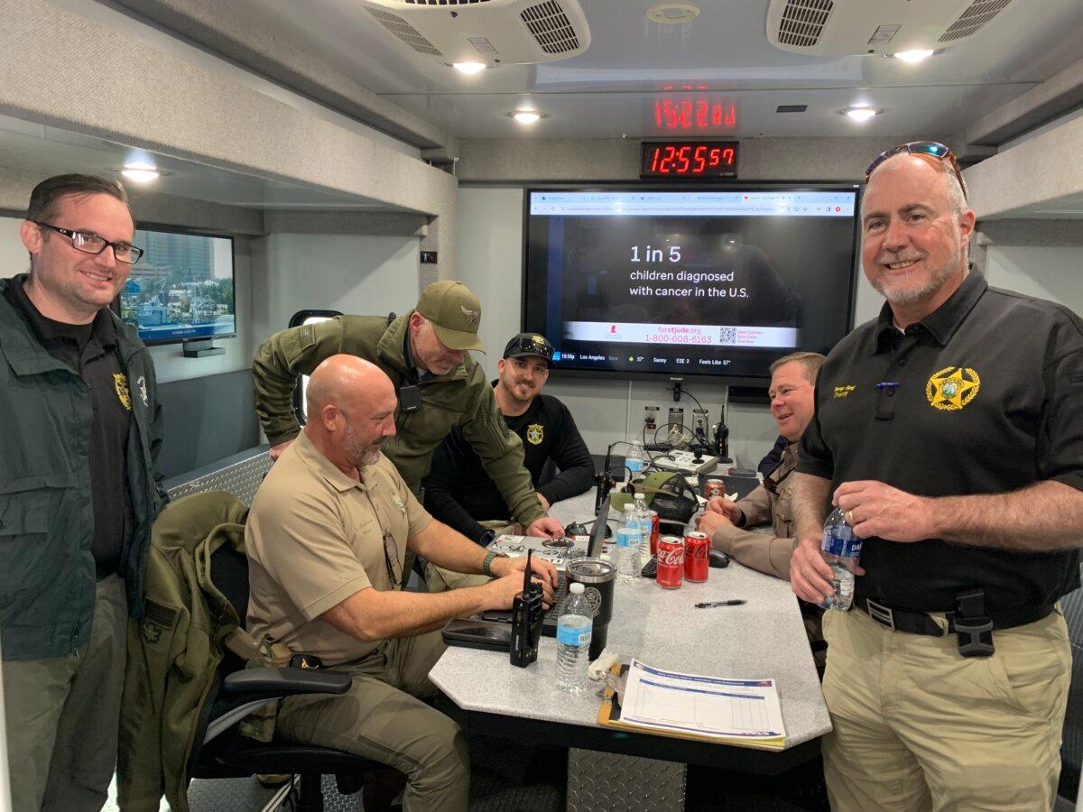 Bay County Sheriff Tommy Ford (R) with his staff at their forward operating center just across the bridge from Lower Grand Lagoon, Fla. on Jan. 10, 2024. (T.J. Muscaro/The Epoch Times).