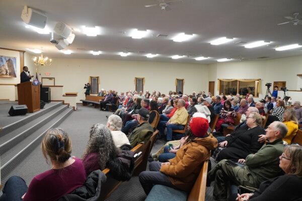 The crowd listens as Dr. Ben Carson speaks at a pro-Trump event at a church in Marion, Iowa, on Jan. 11, 2024. (Nathan Worcester/The Epoch Times)