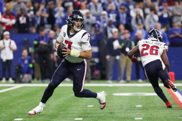 C.J. Stroud (7) of the Houston Texans looks to pass during the third quarter against the Indianapolis Colts at Lucas Oil Stadium in Indianapolis, Ind., on Jan. 6, 2024. (Michael Hickey/Getty Images)