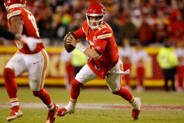 Patrick Mahomes (15) of the Kansas City Chiefs runs with the ball during the fourth quarter against the Cincinnati Bengals at GEHA Field at Arrowhead Stadium in Kansas City, Mo., on Dec. 31, 2023. (David Eulitt/Getty Images)
