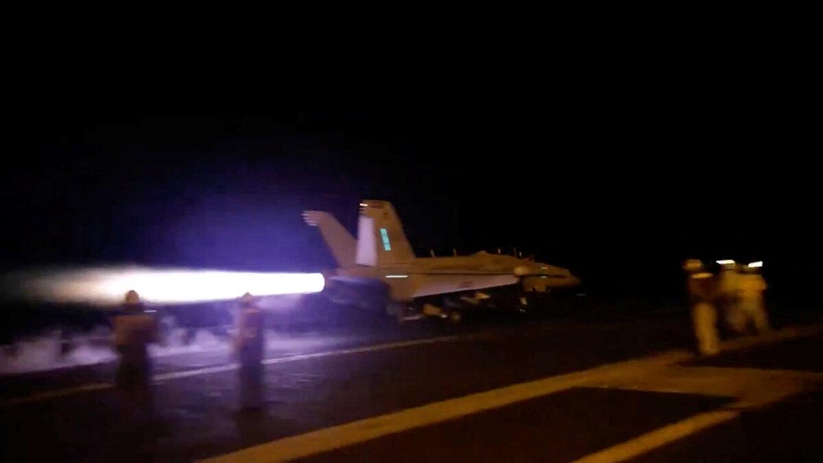 An aircraft takes off to join the U.S.-led coalition to conduct air strikes against military targets in Yemen, aimed at the Iran-backed Houthi terrorists that have been targeting international shipping in the Red Sea from an undisclosed location in this screengrab from a handout video released on Jan. 12, 2024. (U.S. Central Command via X/Handout via Reuters)
