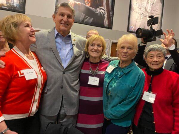 Sen. Joe Manchin poses for pictures with audience members following the kick off of his 'Americans Together' Tour in New Hampshire, on Jan. 12, 2023. (Photo by Alice Giordano)