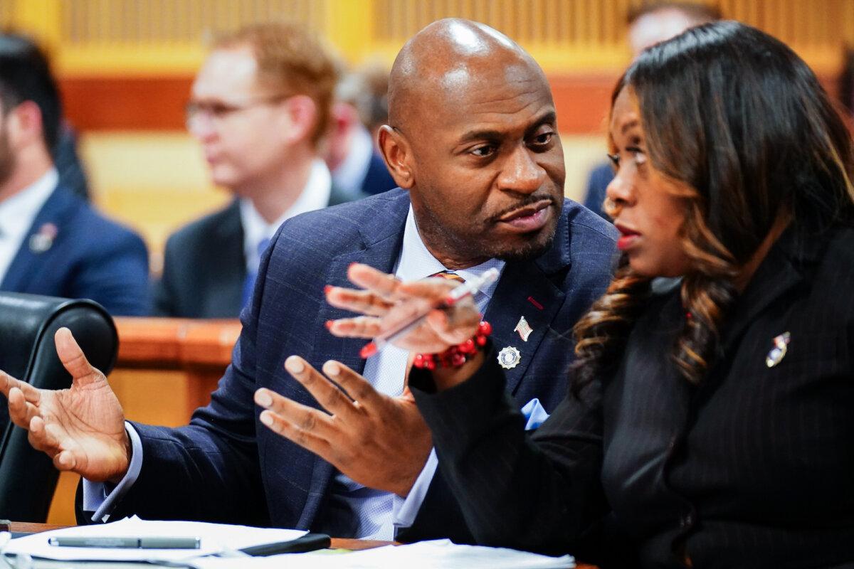 Fulton County special prosecutor Nathan Wade (L) and executive district attorney Daysha Young confer during a hearing in the election interference case against President Trump, at the Fulton County Courthouse in Atlanta, Ga., on Dec. 1, 2023. (John David Mercer-Pool/Getty Images)