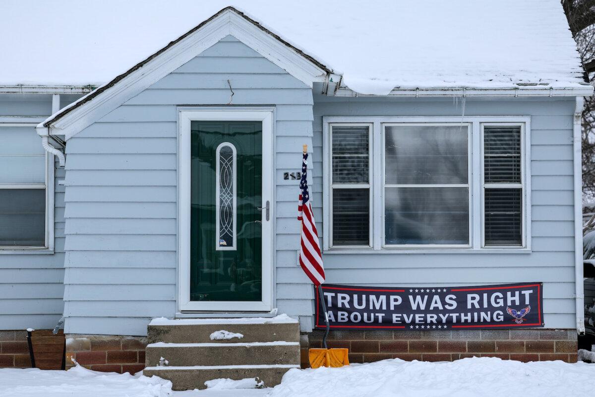 A sign supporting Republican presidential candidate former President Donald Trump is displayed on a house on Jan. 11, 2024, in Ogden, Iowa. Voters in Iowa are preparing for the Republican Party of Iowa's presidential caucuses on Jan. 15. (Kevin Dietsch/Getty Images)