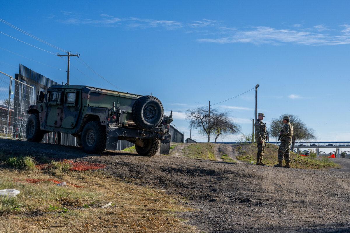 National Guard soldiers stand guard on the banks of the Rio Grande River at Shelby Park in Eagle Pass, Texas, on Jan. 12, 2024. (Brandon Bell/Getty Images)
