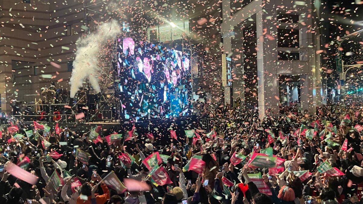 Supporters of Democratic Progressive Party presidential candidate Lai Ching-te celebrate the election returns in Taipei, Taiwan, on Jan. 13, 2024. (Melina Chan/The Epoch Times)