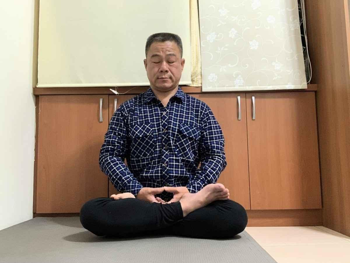 Mr. Huang practicing Falun Gong meditation. (Photo provided by Mr. Huang)