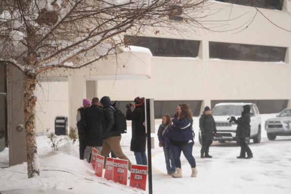 People arrive at a campaign event for Republican presidential candidate Florida Gov. Ron DeSantis in West Des Moines, Iowa, on Jan. 13, 2024. (Madalina Vasiliu/The Epoch Times)