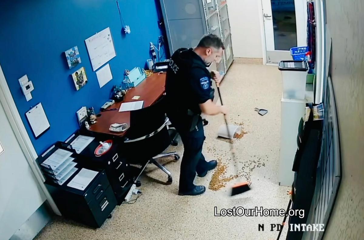 The officer helped clean the mess after putting King back in his kennel. (Courtesy of <a href="https://www.lostourhome.org/">Lost Our Home Pet Rescue</a>)
