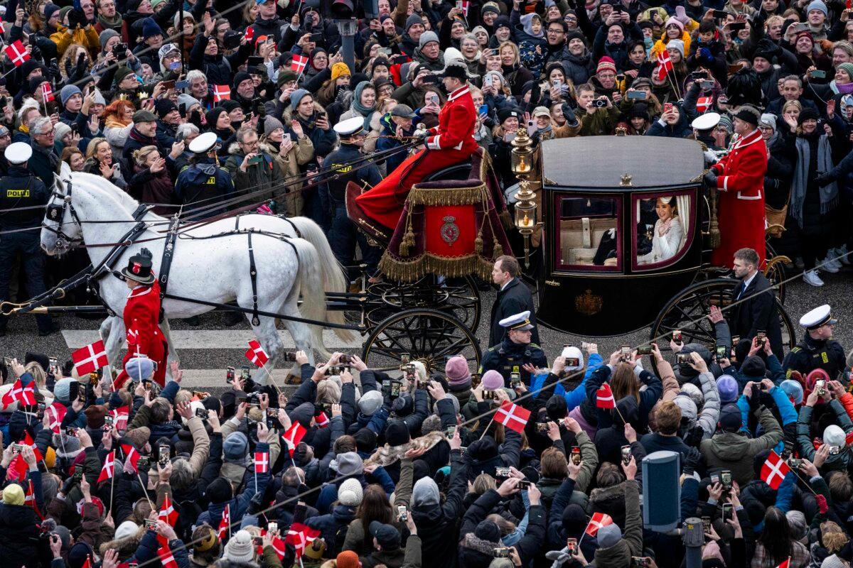 King Frederik X of Denmark and Queen Mary of Denmark make their way past crowds of wellwishers in their carriage in Copenhagen, Denmark on Jan. 14, 2024. (Ida Marie Odgaard/Getty Images)