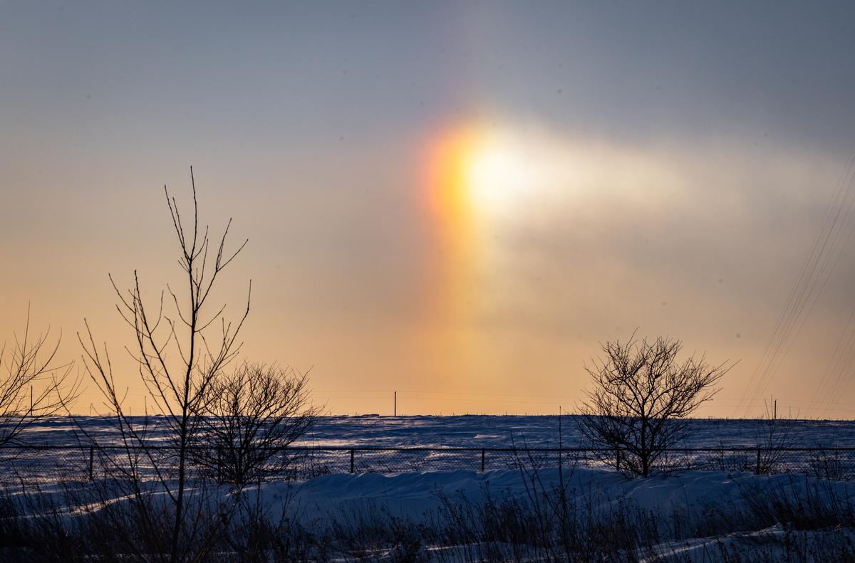 A rainbow touches down after a major snowstorm outside of Des Moines, Iowa, on Jan. 14, 2024. (John Fredricks/The Epoch Times)
