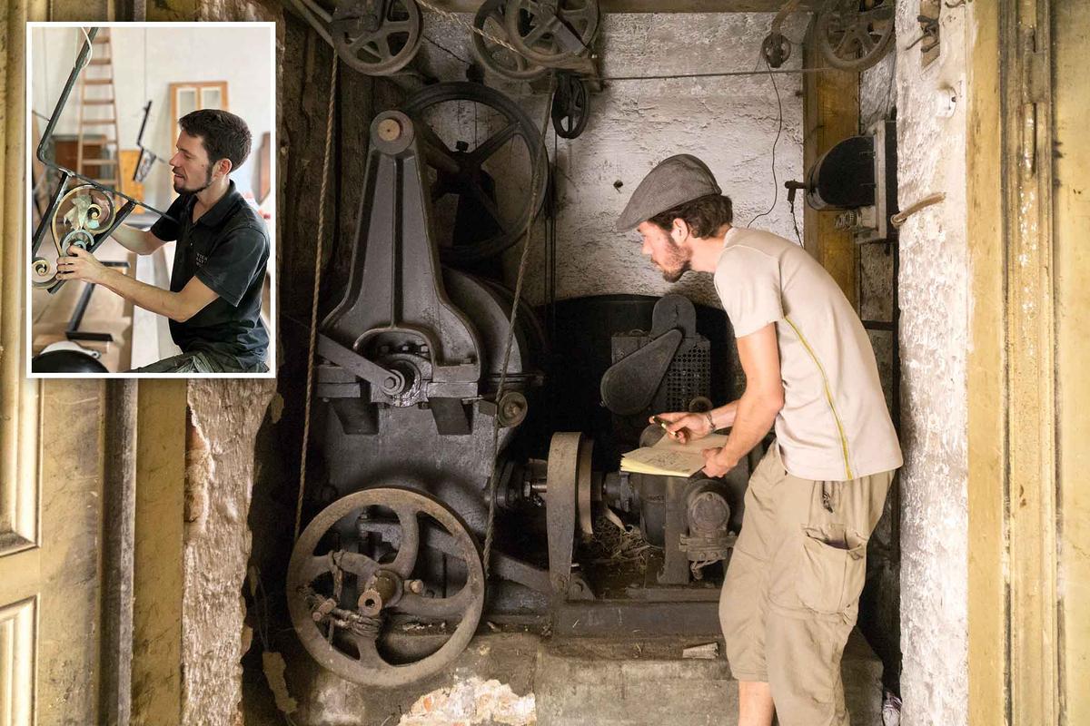 Examining and working on original parts, including an old elevator engine room. (Courtesy of Christian Tauss)