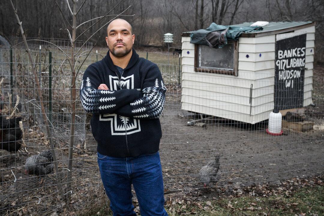 Aaron James, 37, of Lindstrom, Minn., stands near the family's chicken coop that the FBI raided with a drone on Oct. 4, 2021. (Chris Duzynski/For The Epoch Times)