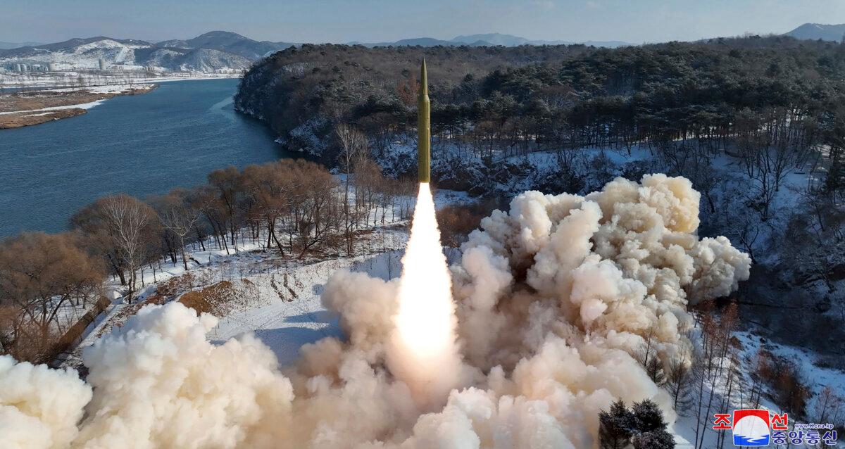 A photo provided by the North Korean regime shows what it says is a flight test of a new solid-fuel, intermediate-range missile in North Korea on Jan. 14, 2024. (Korean Central News Agency/Korea News Service via AP)
