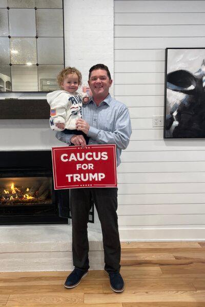 Tim Krachenfels, 45, holds his son, Courage, 2, as he prepares to go to a caucus site near their home in West Des Moines, Iowa, on Jan. 15, 2024. (Courtesy of Tim Krachenfels)