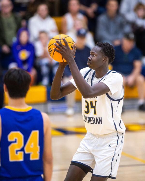 Sophomore forward Will Malual (34) plays for the Crean Lutheran High School’s boys’ basketball team. (Courtesy of Nate Klitzing)