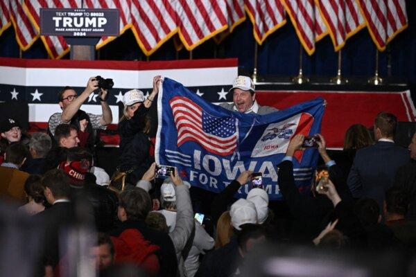 Supporters of former US President and Republican presidential hopeful Donald Trump celebrate at a watch party during the 2024 Iowa Republican presidential caucuses in Des Moines, Iowa, on Jan. 15, 2024. (Jim Watson/AFP via Getty Images)
