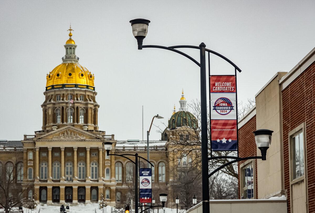 Advertising for the Iowa caucus line the streets of Des Moines, Iowa, on Jan. 15, 2024. (John Fredricks/The Epoch Times)
