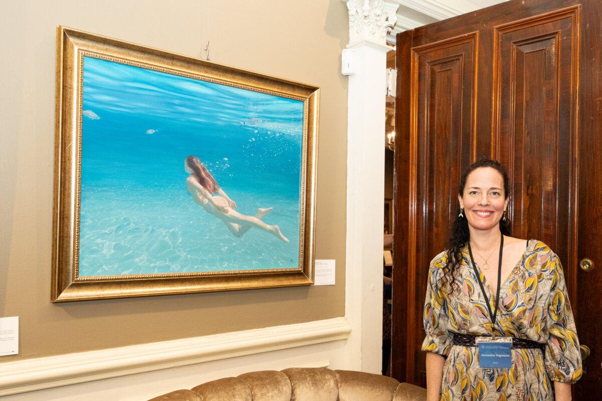 Alexandra Telgmann with her piece "Immerse Yourself." Oil on aluminum. The NIFPC finalist exhibition at the Salmagundi Club, New York City, on Jan. 15, 2024. (Larry Dye/The Epoch Times)