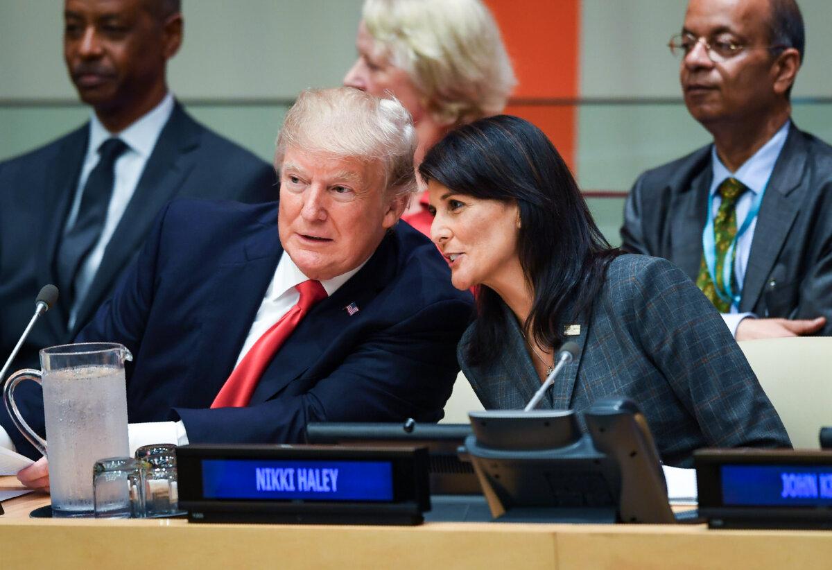 Former President Donald Trump and then-U.S. Ambassador to the United Nations Nikki Haley speak during a meeting on United Nations reform at the U.N. Headquarters in New York on Sept. 18, 2017. (Timothy A. Clary/AFP/Getty Images)