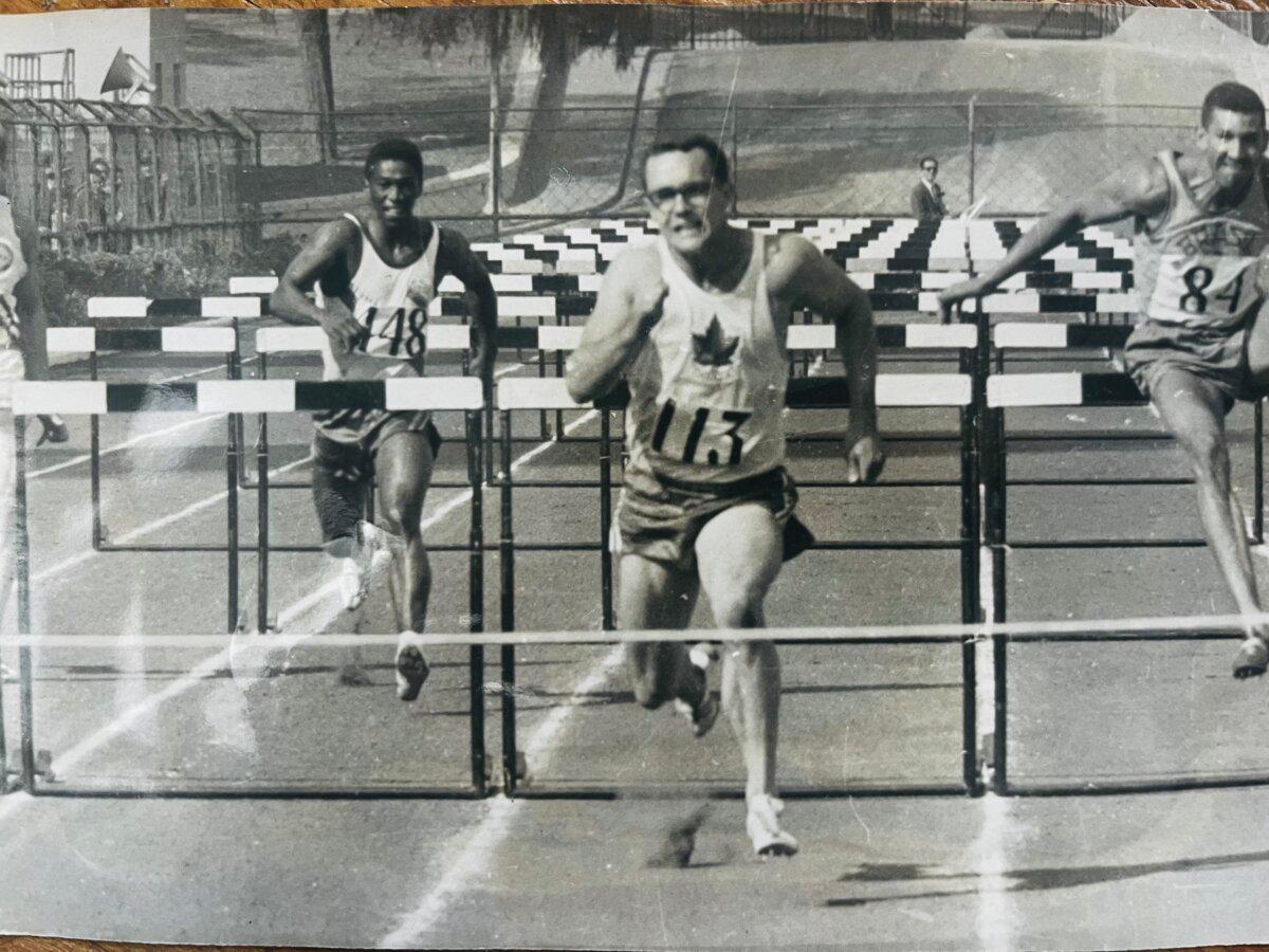 William Gairdner approaches the finish line during a hurdles race while taking part in a decathlon competition. (Courtesy of Gairdner family)