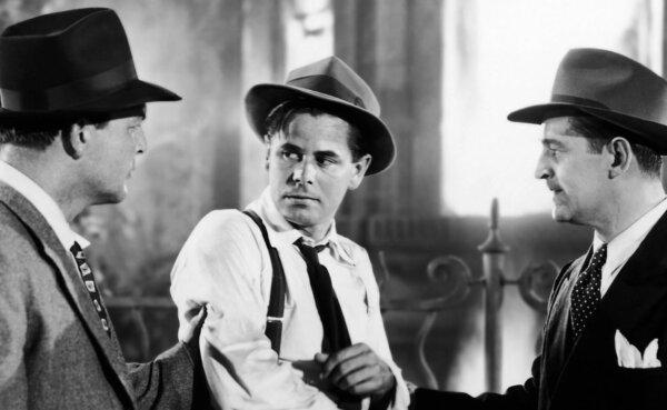 Joe Miracle (Glenn Ford) being accosted by gangsters, in “Mr. Soft Touch.” (Columbia Pictures)