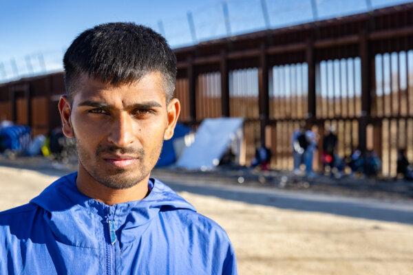Sheraz Mesih, a persecuted Christian from the nation of Pakistan, awaits to be processed by border patrol agents after crossing the United States border on Jan. 16, 2024. (John Fredricks/The Epoch Times)