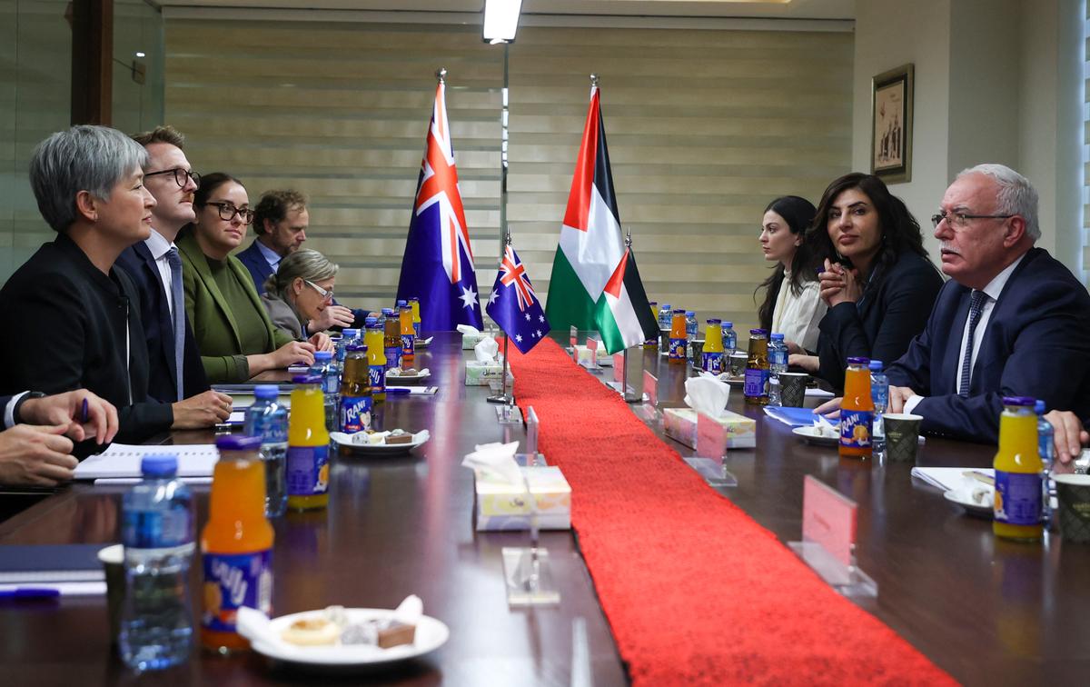 Palestinian Foreign Minister Riyad al-Maliki (R) receives Australian Foreign Minister Penny Wong (L) and members of her delegation, in Ramallah, in the occupied West Bank on Jan. 17, 2024. (Jaafar Ashtiyeh/AFP via Getty Images)