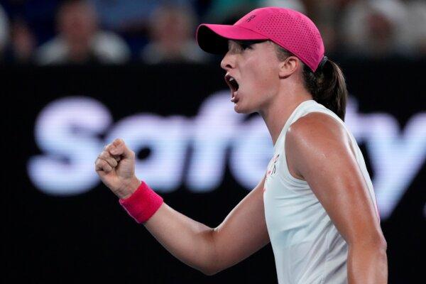 Iga Swiatek of Poland reacts after winning a point against Danielle Collins of the U.S. during their second-round match at the Australian Open tennis championships at Melbourne Park, Melbourne, Australia, on Jan. 18, 2024. (Andy Wong/AP Photo)