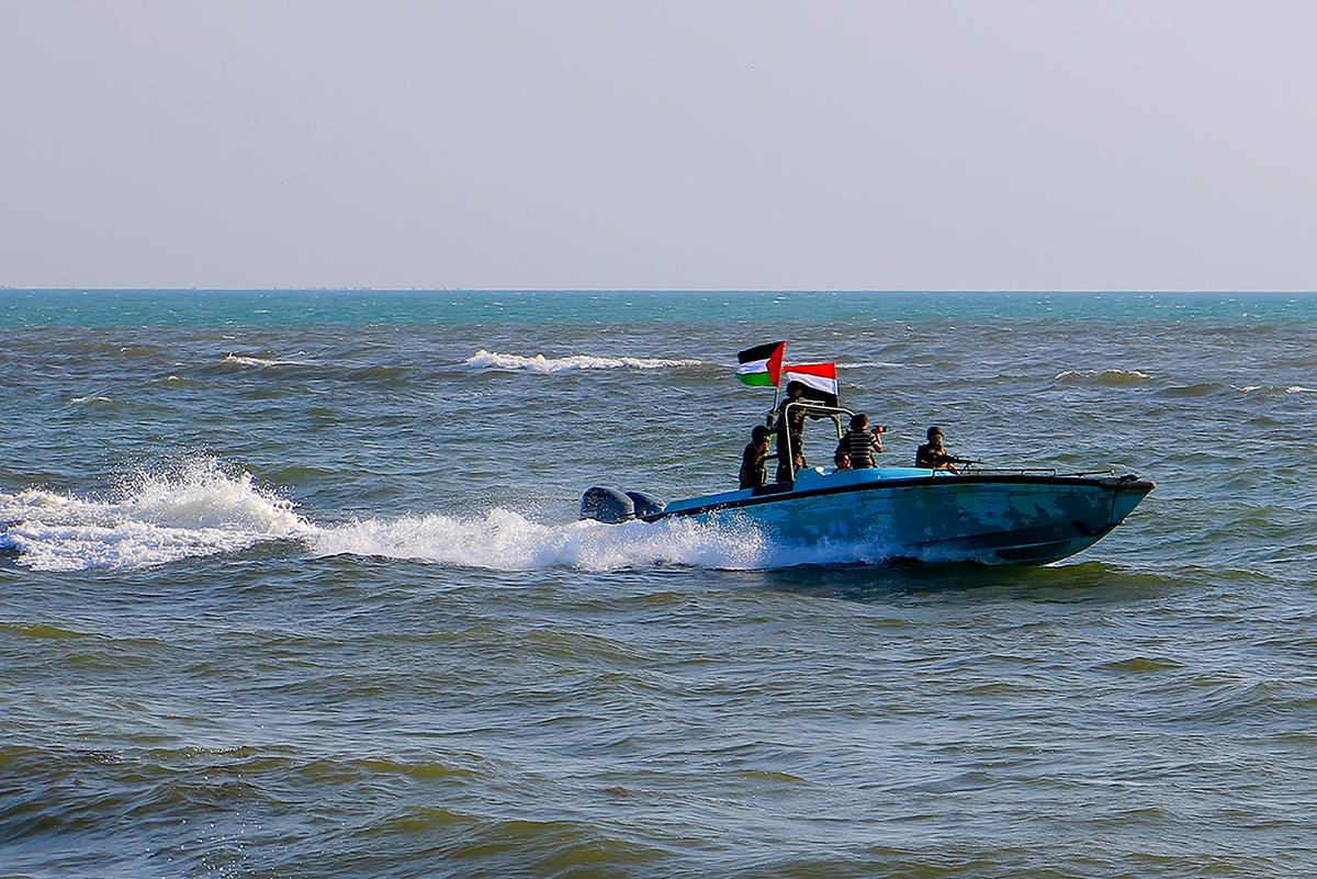 Members of the Yemeni Coast Guard affiliated with the Houthi group patrol as demonstrators march through the Red Sea port city of Hodeida in solidarity with the people of Gaza, on Jan. 4, 2024. (AFP via Getty Images)