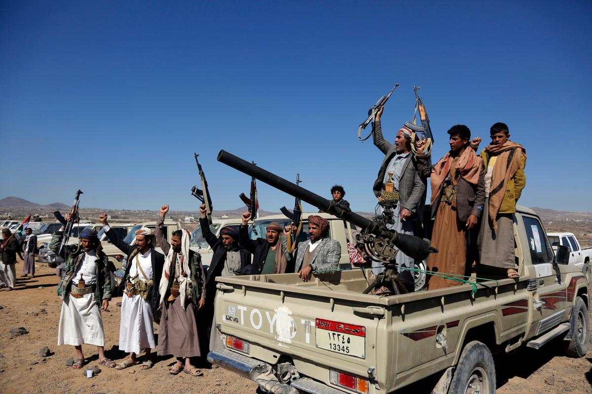 Houthi gunmen and tribesmen stage a rally against the U.S. and the UK strikes on Houthi-run military sites near Sanaa, Yemen, on Jan. 14, 2024. (AP Photo)