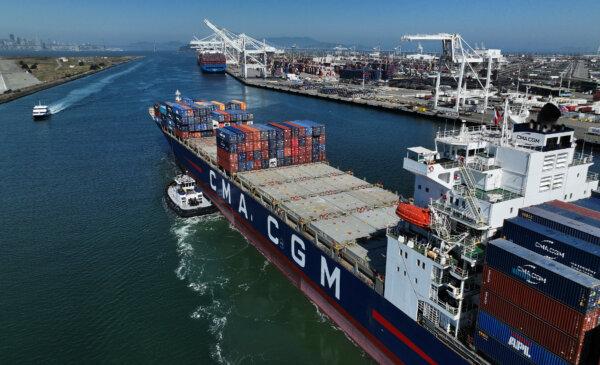 A container ship is guided into the Port of Oakland in Oakland, Calif., on Aug. 7, 2023. (Justin Sullivan/Getty Images