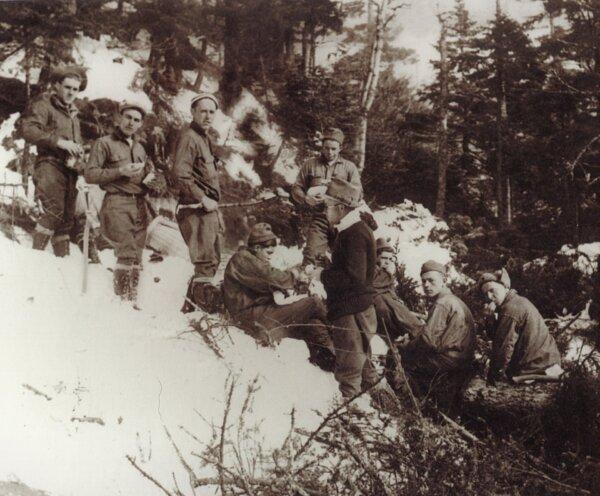 The men of the 191st Civilian Conservation Corps pose for a photograph in the winter of 1933. Paul Barquin (2nd L) was the first to ski a cut trail<span style="color: #ff0000;"> </span>in the state of Vermont. (Courtesy of Stowe Mountain Resort)