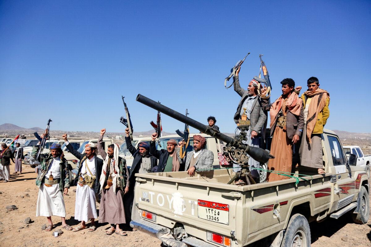 Houthi fighters and tribesmen stage a rally against the U.S. and UK strikes on Houthi-run military sites near Sanaa, Yemen, on Jan. 14, 2024. (AP Photo)