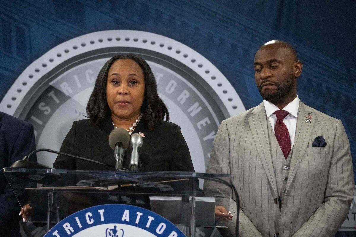 Fulton County District Attorney Fani Willis and Fulton County District Attorney Special Prosecutor Nathan Wade (R) at a press conference in the Fulton County Government Center after a grand jury voted to indict former President Donald Trump and 18 others, in Atlanta on Aug. 14, 2023. (Christian Monterrosa/AFP via Getty Images)