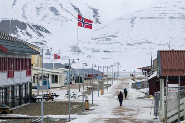 The Norwegian flag flutters on the roadside of Longyearbyen's main street, on May 9, 2022, on Spitsbergen island, in Svalbard Archipelago, northern Norway. (Jonathan Nackstrand/AFP via Getty Images)