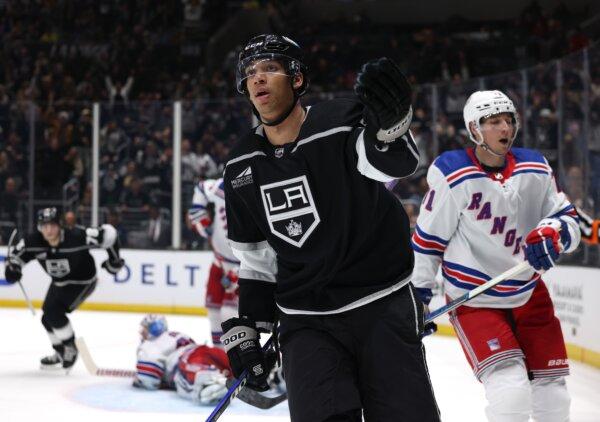 Quinton Byfield (55) of the Los Angeles Kings celebrates his goal in front of Tyler Pitlick (71) of the New York Rangers during the second period in Los Angeles on Jan. 20, 2024. (Harry How/Getty Images)