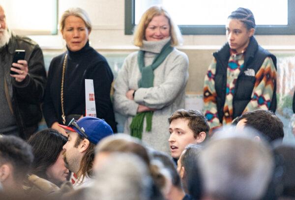 A climate change heckler interupts presidential candidate Nikki Haley as she speaks in Derry, New Hampshire, on Jan. 21, 2024. (John Fredricks/The Epoch Times)