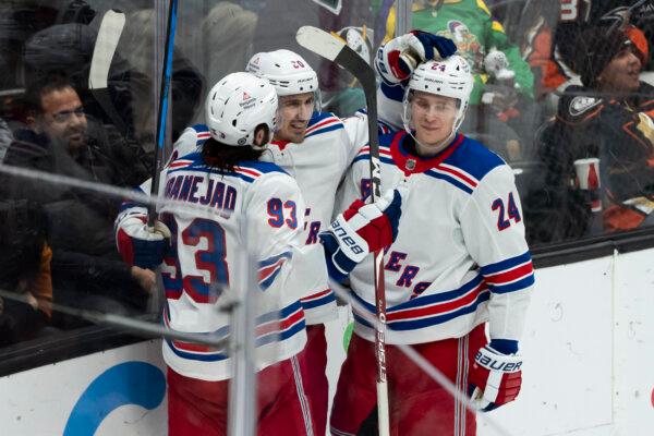 New York Rangers left wing Chris Kreider (20) celebrates after his goal with center Mika Zibanejad (93) and right wing Kaapo Kakko (24) during the third period of an NHL hockey game against the Anaheim Ducks in Anaheim, Calif., on Jan. 21, 2024. (Kyusung Gong/AP Photo)