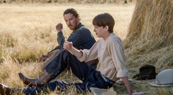 Phil Burbank (Benedict Cumberbatch, L) teaching Peter Gordon (Kodi Smit-McPhee) the ways of manhood, in “The Power of the Dog” (Netflix)