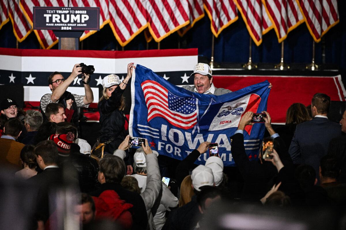 Supporters of former President Donald Trump celebrate at a watch party during the Iowa Republican presidential caucuses in Des Moines, Iowa, on Jan. 15, 2024. (Jim Watson/AFP via Getty Images)