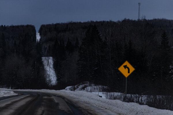 A treeline gap seperates the US/Canadian border in Quebec, Canada, on Jan. 22, 2024. (John Fredricks/The Epoch Times)