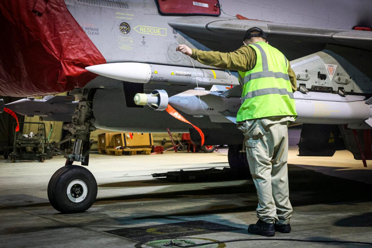 An undated handout photo issued on Jan. 22, 2024, by the UK’s Ministry of Defence of RAF armorers preparing a Royal Air Force Typhoon FGR4. RAF Typhoon aircraft have conducted precision strike operations against Houthi military targets in response to further attacks on shipping in the Red Sea. (Leah Jones/MoD/PA Wire)