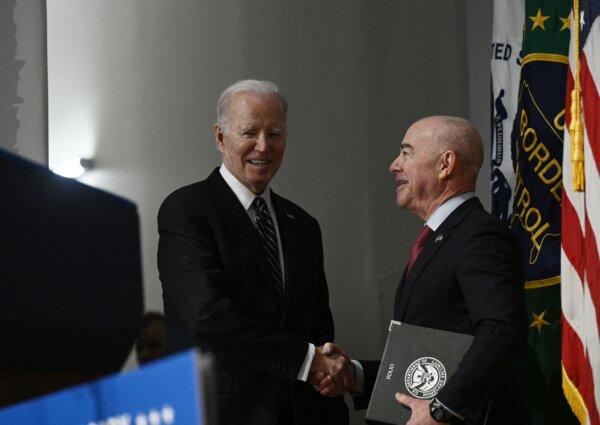 President Joe Biden (L) greets Homeland Security Secretary (DHS) Alejandro Mayorkas as he arrives to speak at the DHS 20th Anniversary Ceremony at DHS headquarters in Washington, on March 1, 2023. (Brendan Smialowski/AFP via Getty Images)