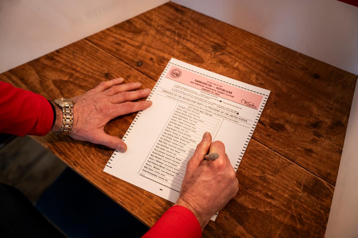 Republican State Sen. Tim Lang prepares to vote at a polling site in Sanbornton Town Hall in Sanbornton, N.H., on Jan. 23, 2024. (Madalina Vasiliu/The Epoch Times)