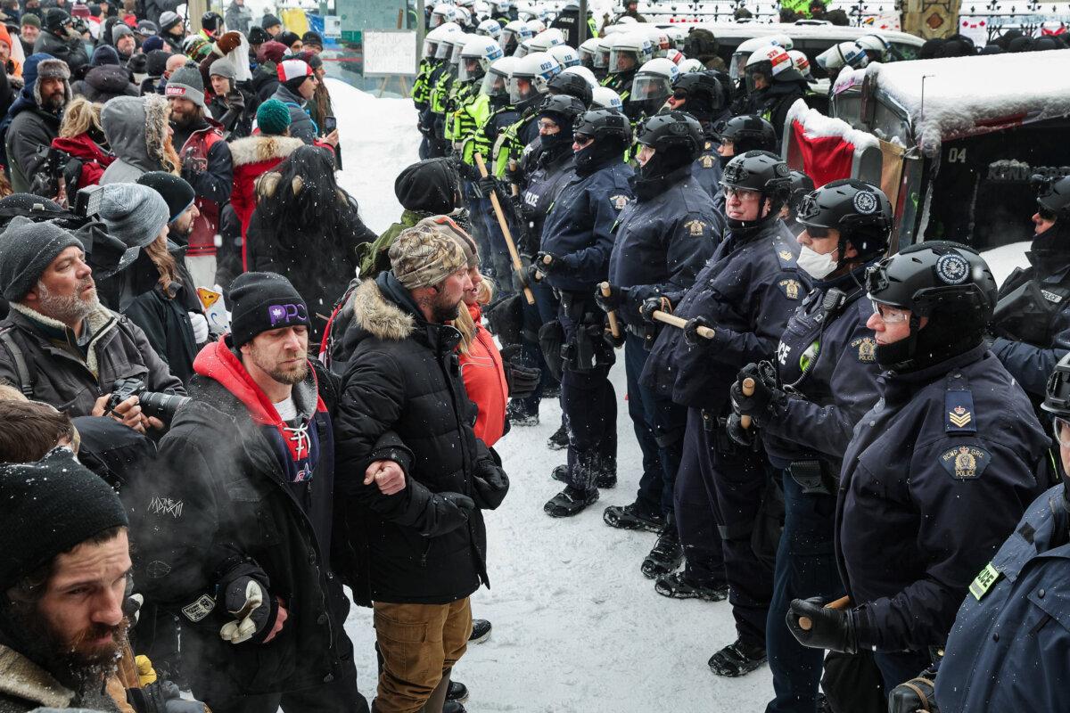 Police confront participants of the Freedom Convoy protest on Feb. 19, 2022, after the Emergencies Act was invoked several days earlier. (Scott Olson/Getty Images)