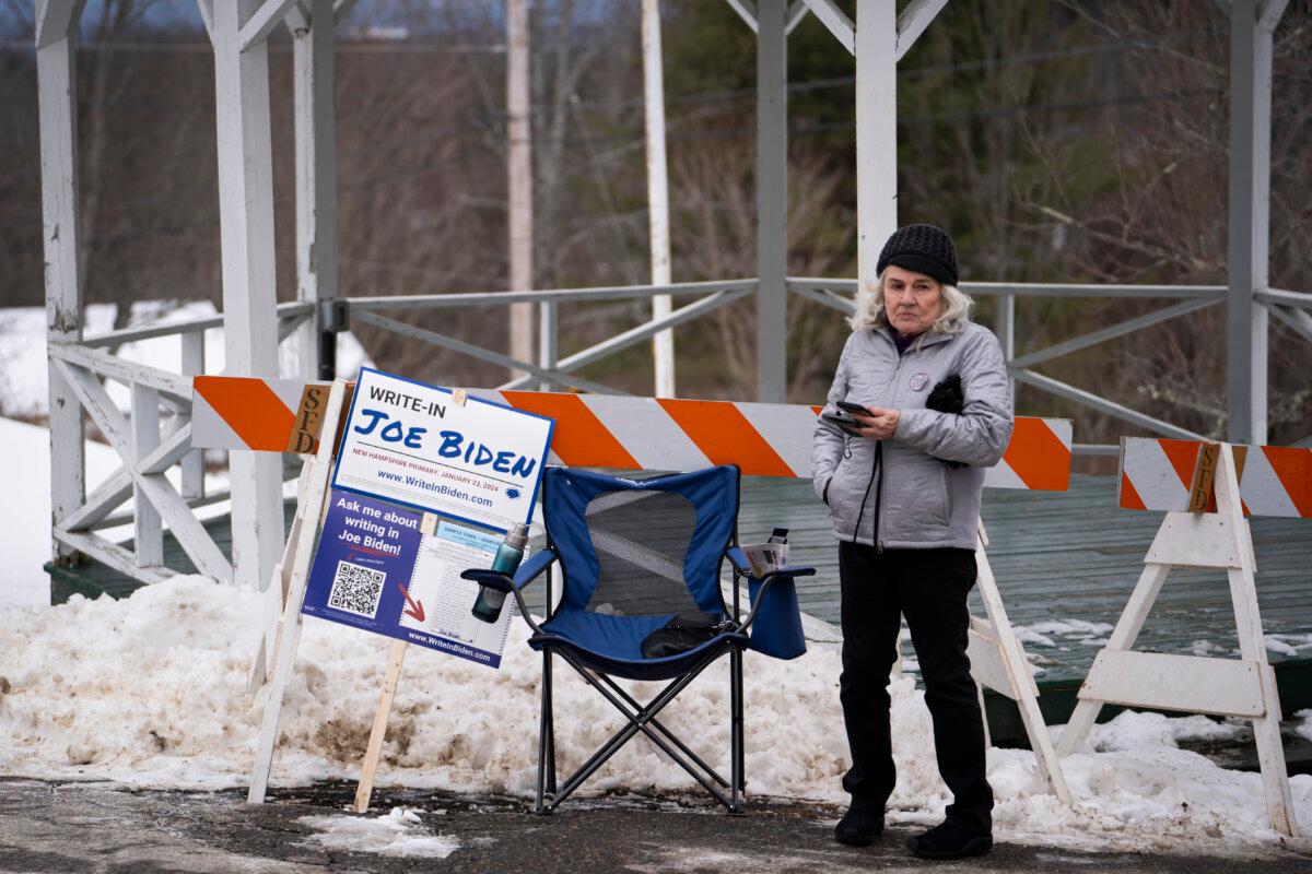 A sign urging voters to write in President Joe Biden in the New Hampshire primary voting at a polling site in Sanbornton Town Hall in Sanbornton, N.H., on Jan. 23, 2024. (Madalina Vasiliu/The Epoch Times)