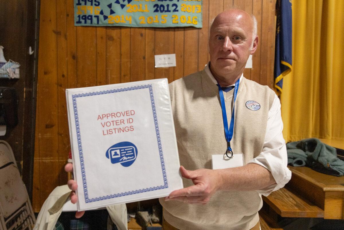 Steven Pesci holds election paperwork in Portsmouth, New Hampshire, on Jan. 23, 2024. (John Fredricks/The Epoch Times)